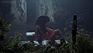 werewolf ravishes woman in a graveyard