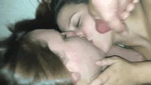 Two sluts kissing and sharing a facial