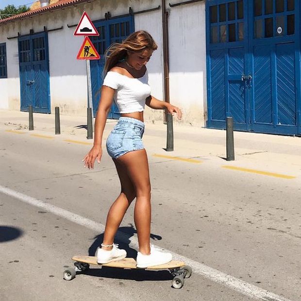 Hot legs and short shorts on a skateboard
