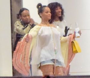 Rihanna Braless in See Through White Blouse