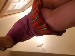 Cute brunette in plaid skirt, no panties.