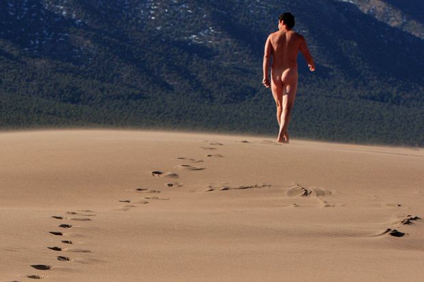 nude male walking in the desert showing ass