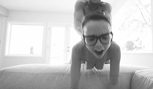 dilion in the b e d with glasses