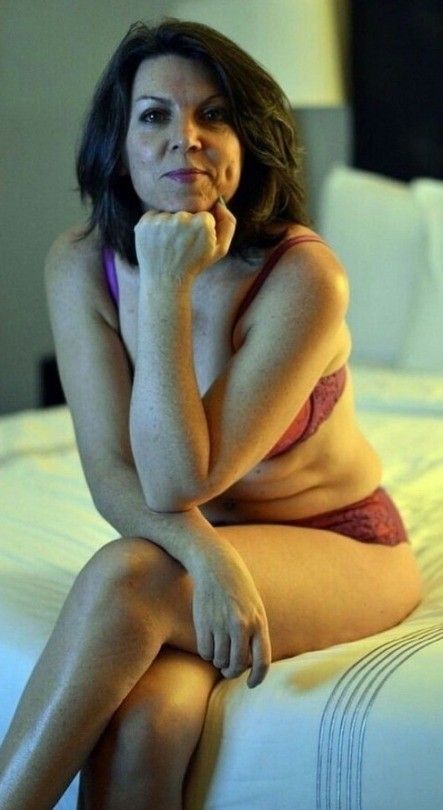 Milf sitting on bed waiting....
