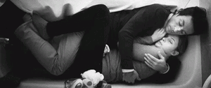 Cuddling in the bath, with our clothes on