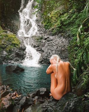 Sexy babe by the waterfall