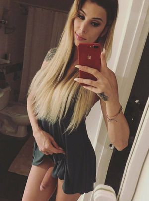 Casey kisses dangles in mirror