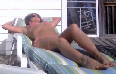 Sexy MILF Lisa Laying Out In Her String Bikini.