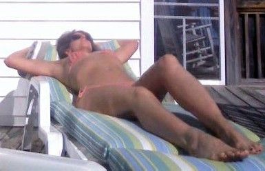 Sexy MILF Lisa Laying Out In Her String Bikini.