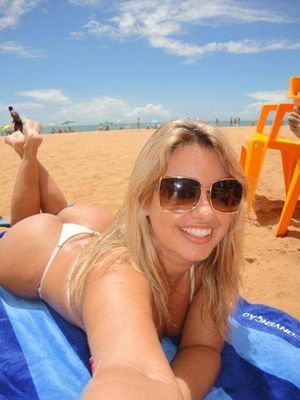 Fine ass babe on the beach shows her feet