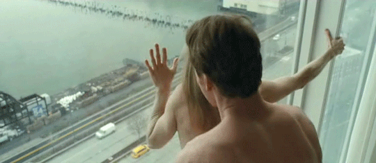 against the window