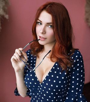 Covered up cute redhead.