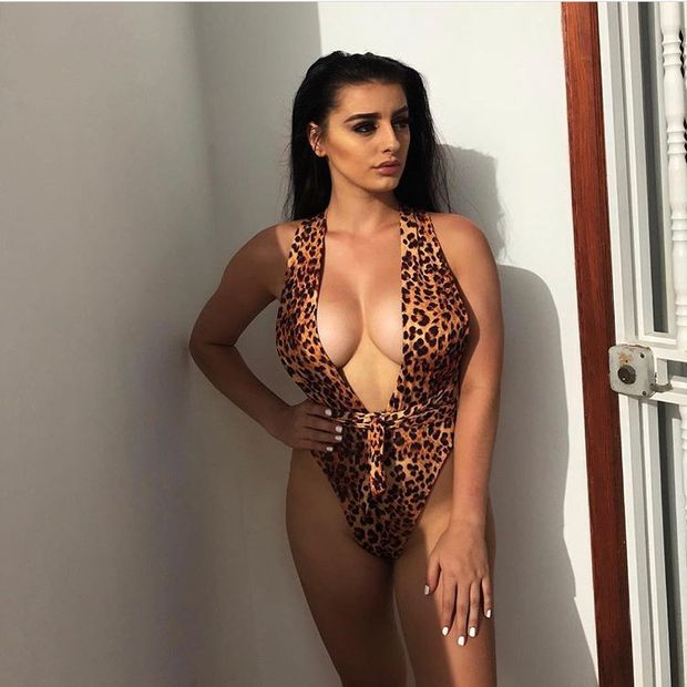 Busty teen with perfect tits shows lots of cleavage