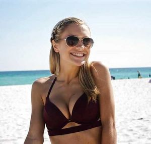 Stunning beach blonde in sunglasses