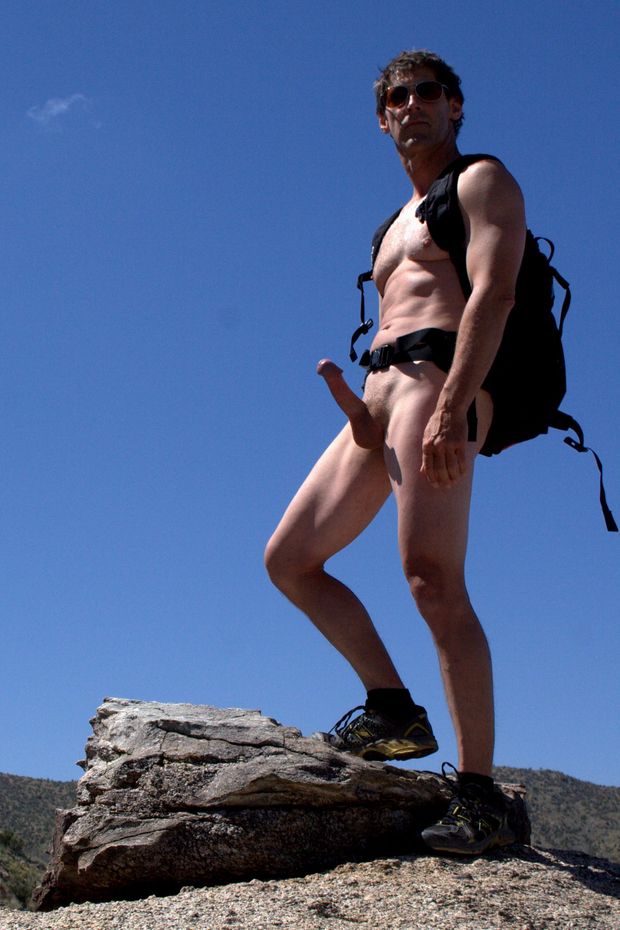 nude male hiking in desert with erection and backpack full of viagra