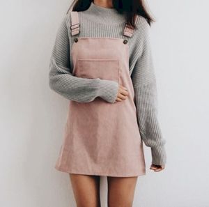 Pink overall and grey sweater