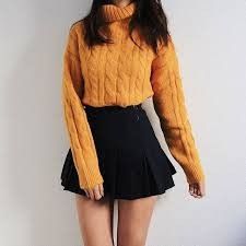 Orange sweater and black skirt