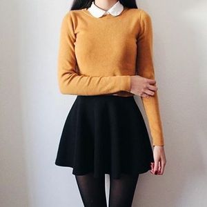 Orange shirt, white collar and black skirt