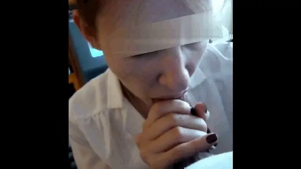 Her head bobs up and down as she sucks his cock