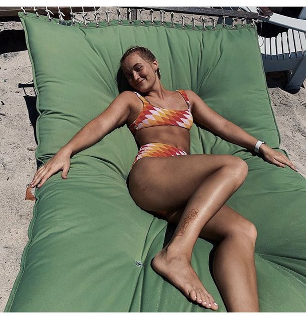 Sarah Herod is looking sexy as hell in orange bikini