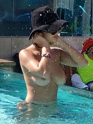 Tao Wickrath topless at a pool party in Las Vegas