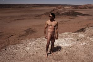 nude male in desert with semi erect cock