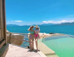 two asian babes in high cut bikinis