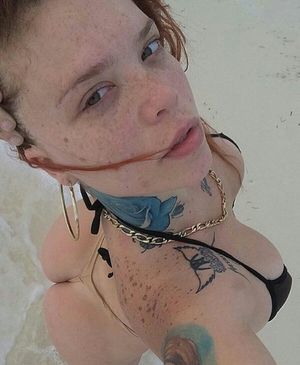 Freckled and tatted teen slut on beach