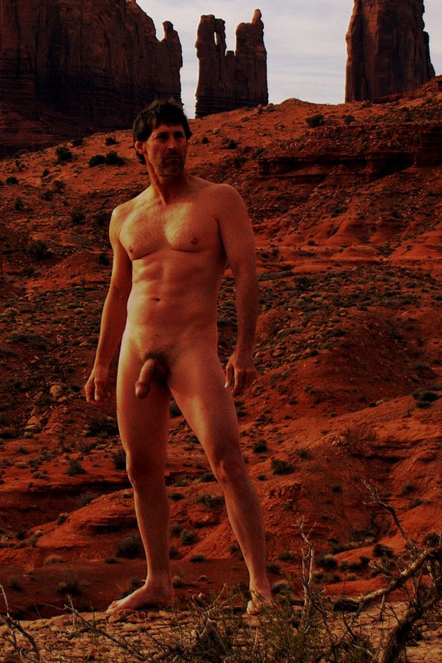 nude male in desert displaying semi erect cock