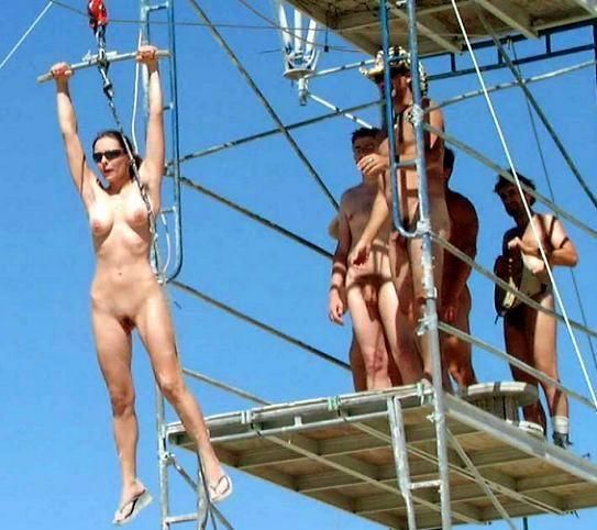 Nude on a zip line.