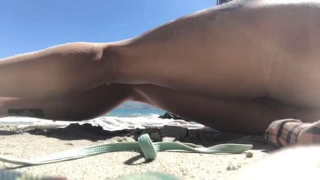 Brunette twerks at the beach