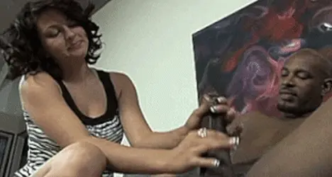 she masturbates him with her hand to give pleasure to his big black cock