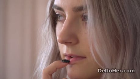 Nail biting teen Tieny Mieny shows her virgin shaved pussy