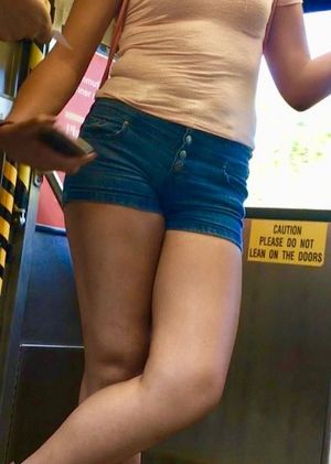 Hottie in tiny shorts riding the train