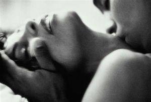 Sensuous cuddle, kissing her neck