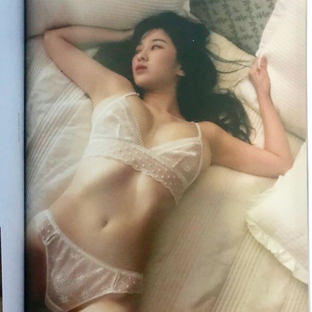 lovely girlfriend lying on bed