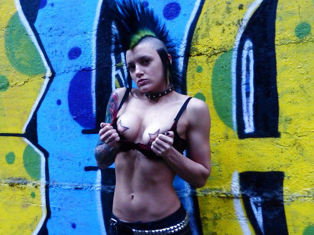 Mohawk babe showing titties!!