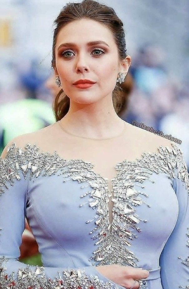Elizabeth Olsen can facially hide her horny self, but her breasts say everything