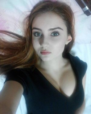 Covered up cute redhead.