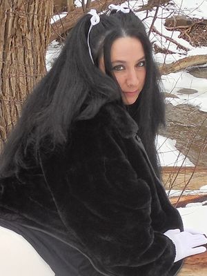 My wife Mercy playing in the winter woods