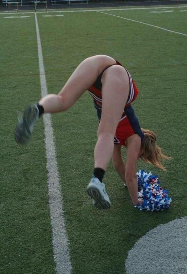 Hot cheerleader doing a handstand