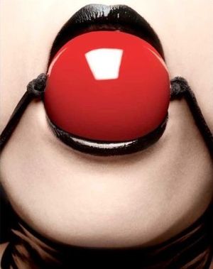 Beautiful red ballgag sitting perfectly in shiny black lips