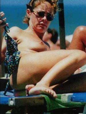 Italian actress Elena Sofia Ricci topless on a beach paparazzi photos