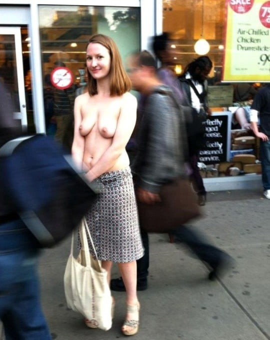 Topless on crowded street
