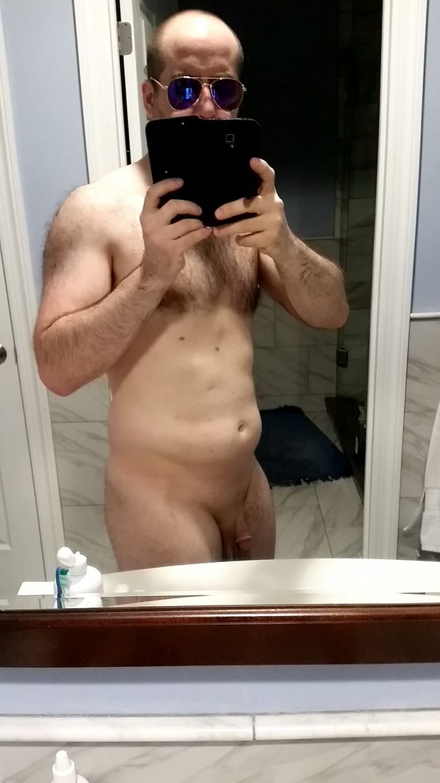 Me fully nude in my bathroom with a soft penis.
