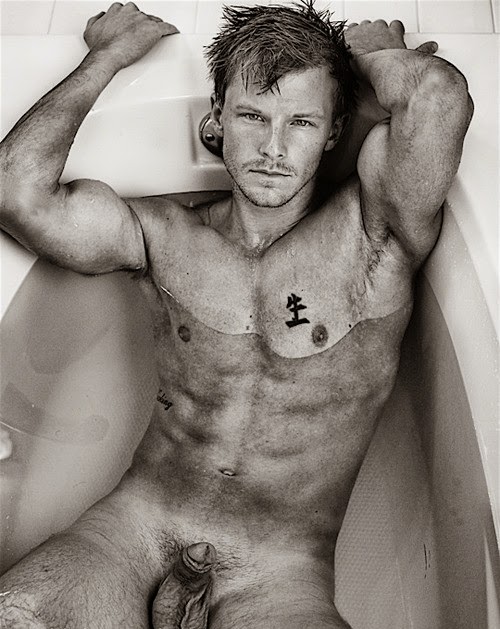 fit guy in tub with soft cock