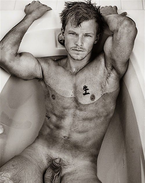 fit guy in tub with soft cock