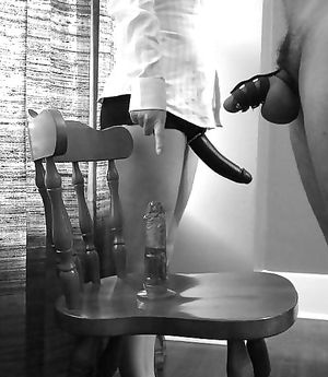 domina shows her submissive the strapon dildo on which he has to fuck his ass