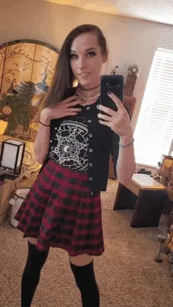 Smiling above her skirt and below