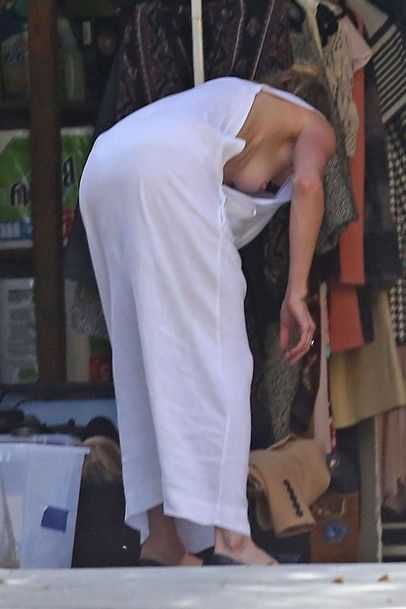 Amber Heard Flashing Boobs While Cleaning Up In Her Garage - 2